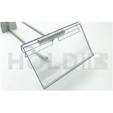A clear plastic T-Bar STRiP Tag Clip with a flip action display, designed for use on wire baskets and pegs, with a reflective surface.