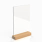 A wooden menu stand with a clear acrylic panel on top of a wooden base.